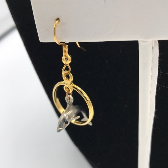 Silver tone dolphin jumping through gold tone hoop earrings - Picture 2 of 6